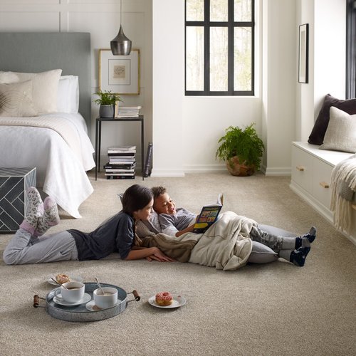 kids reading on bedroom floor